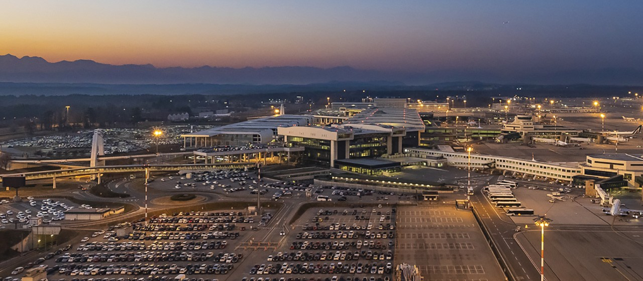 Milan Malpensa Airport terminal at dusk
